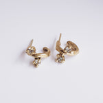 Load image into Gallery viewer, 9k yellow gold small huggie hoop earrings with white lab sapphires on a white background
